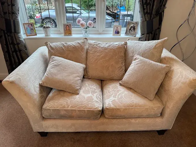 Cream two-seat sofa in a customer's living room